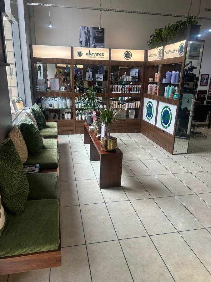 The waiting area and retail shelves by reception